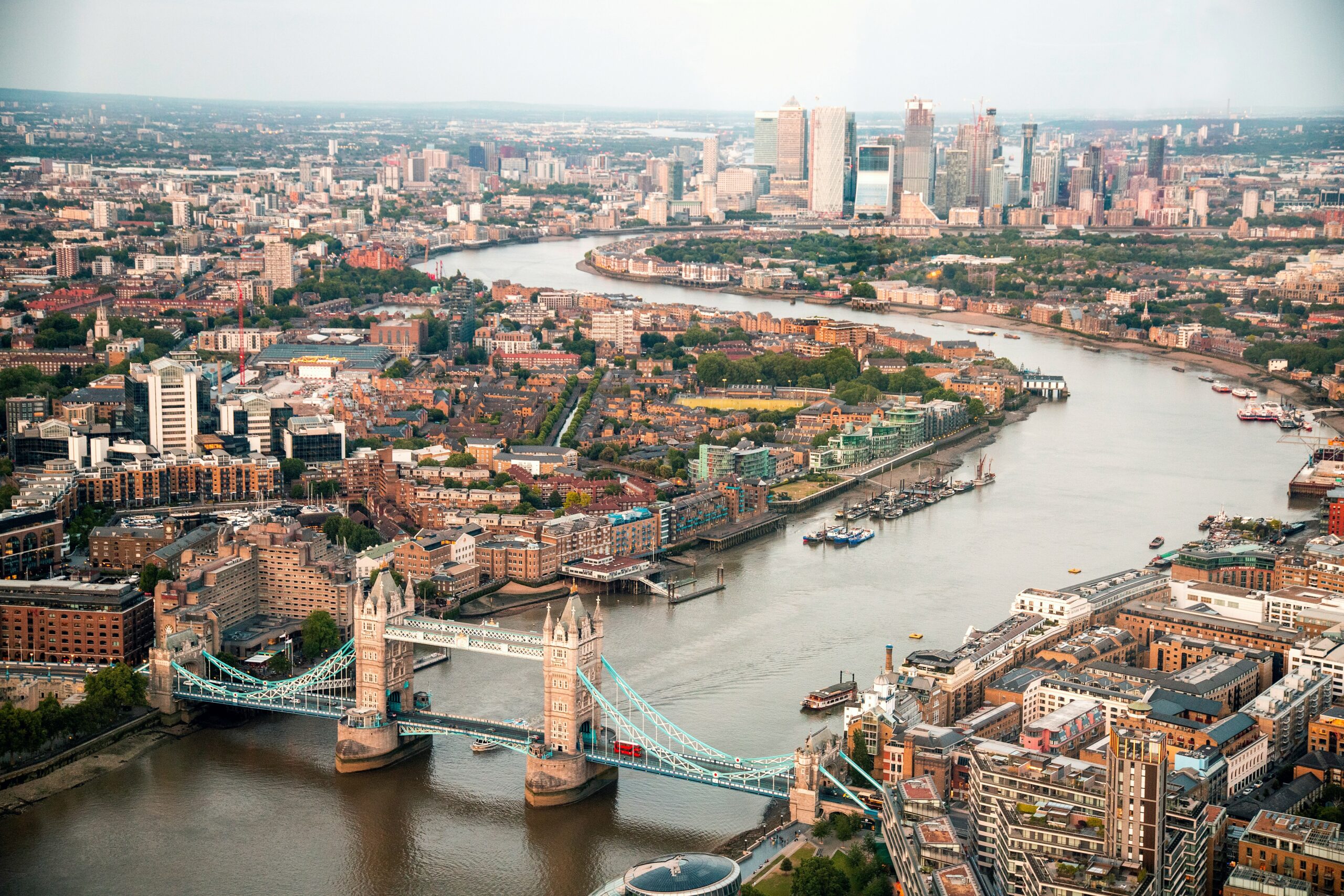 An aerial view of London featuring Tower Bridge and the Shard.