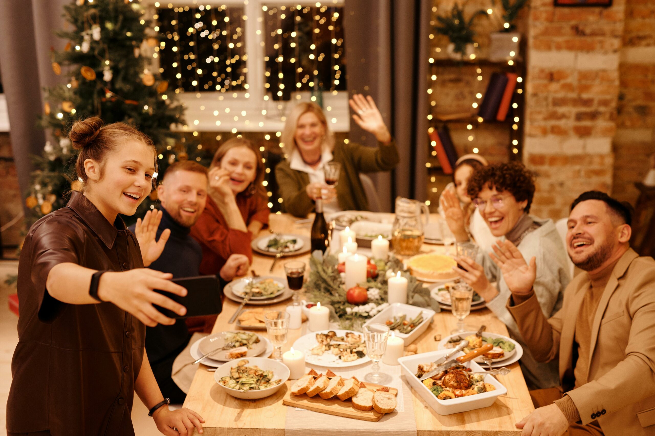 A group of people taking a selfie at a Christmas meal