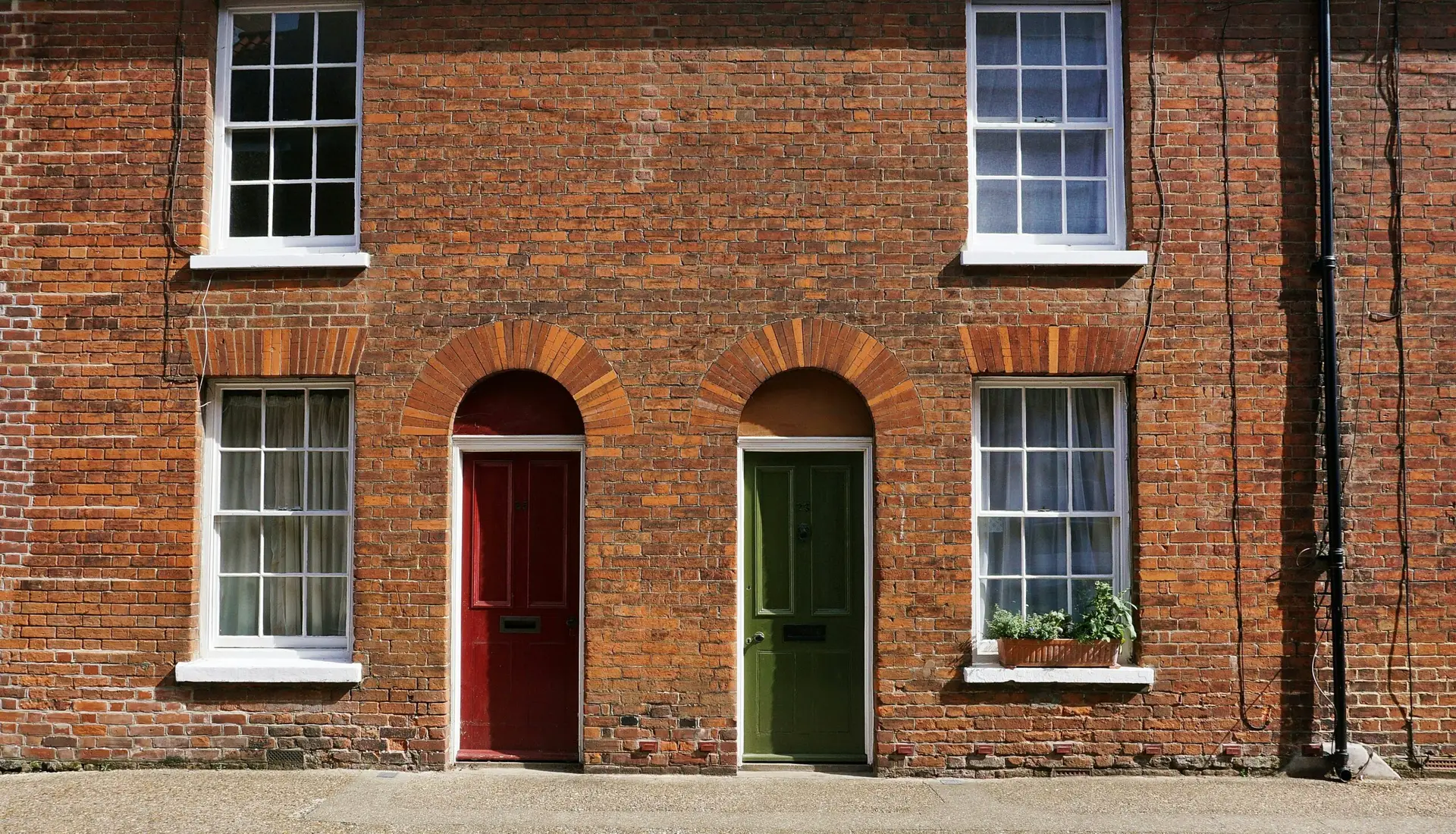 Two houses on a street in the UK.
