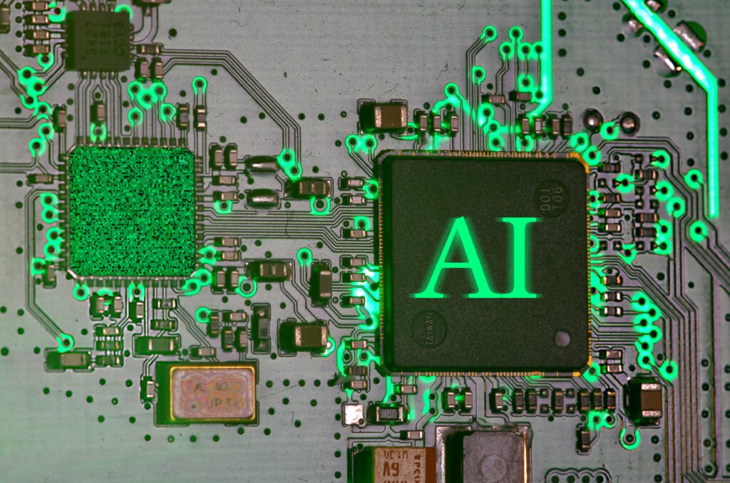 A green circuit board with a square saying AI