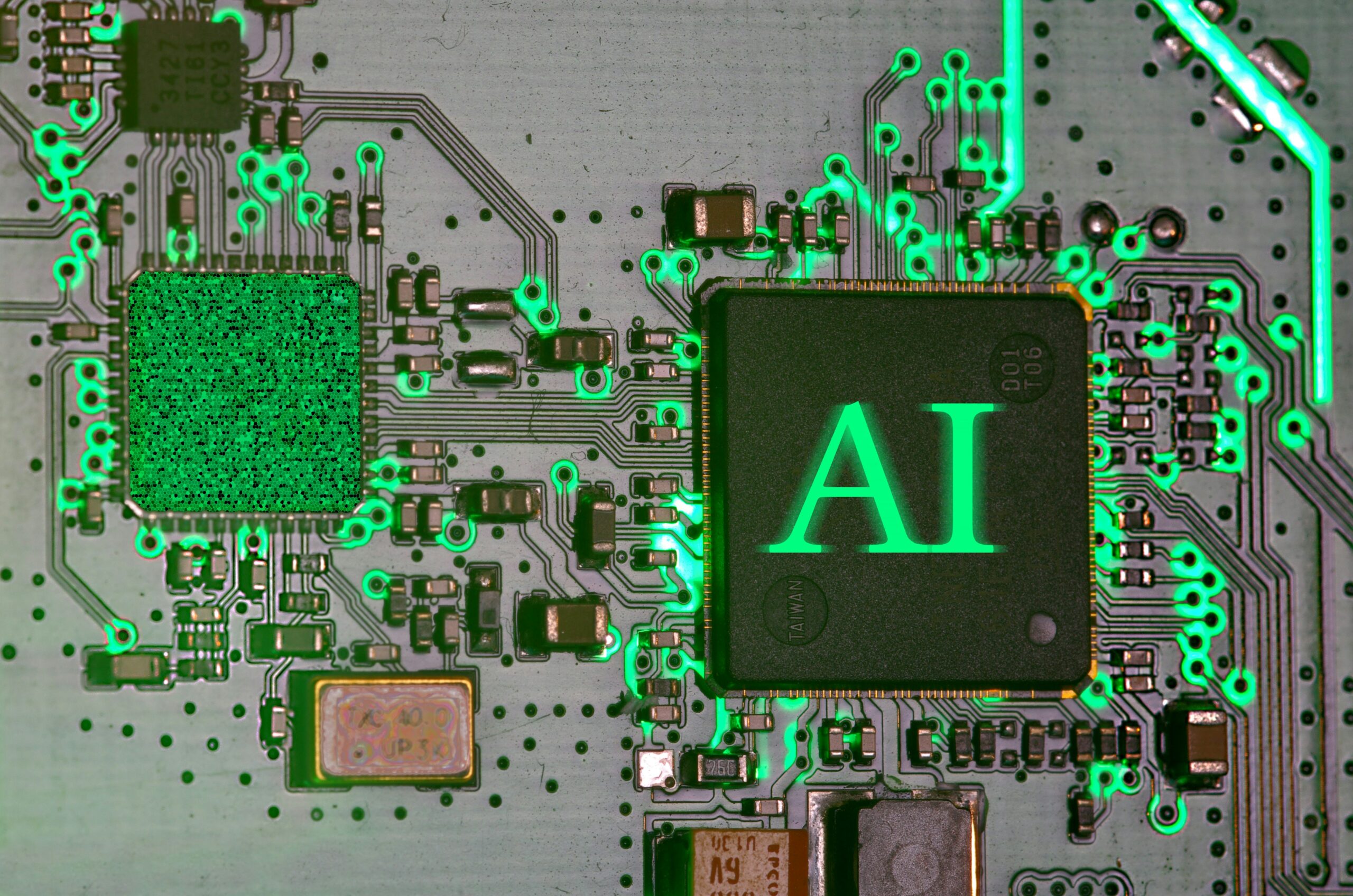 A green circuit board with a square saying AI