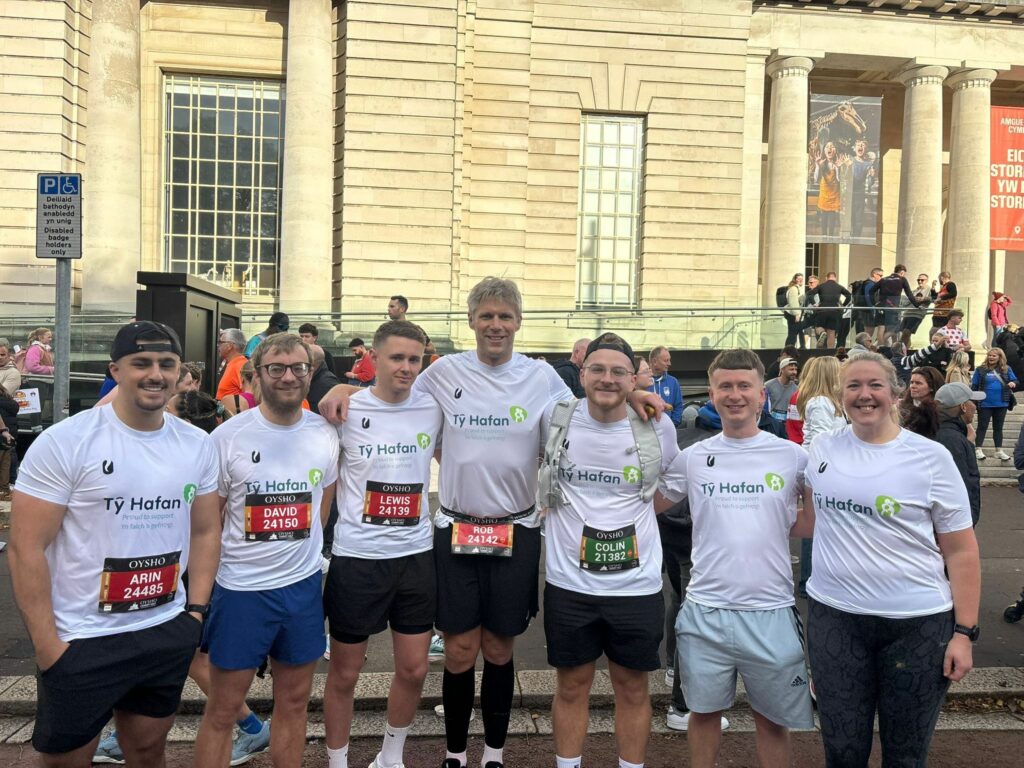 Runners in white charity t-shirts ahead of a half marathon